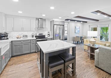 Kitchen with stainless steel appliances in a four-bedroom Signature Collection villa at Cape Canaveral Resort.