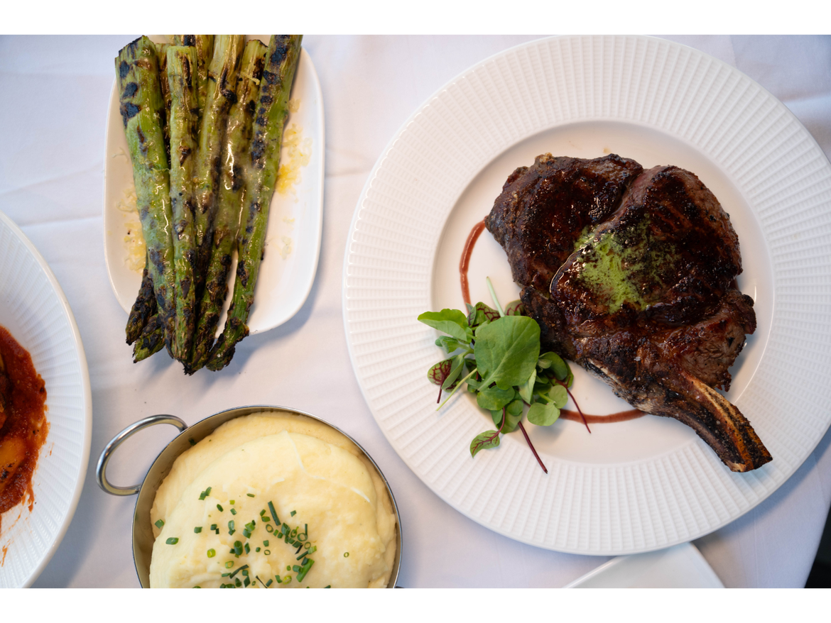 Picture of steak and other food served nicely from the Geneva Chophouse.