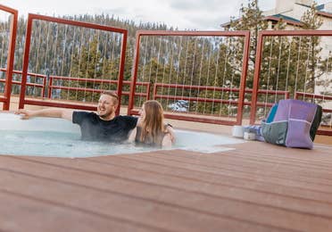 Couple sitting in outdoor hot tub at Tahoe Ridge Resort in Stateline, Nevada.