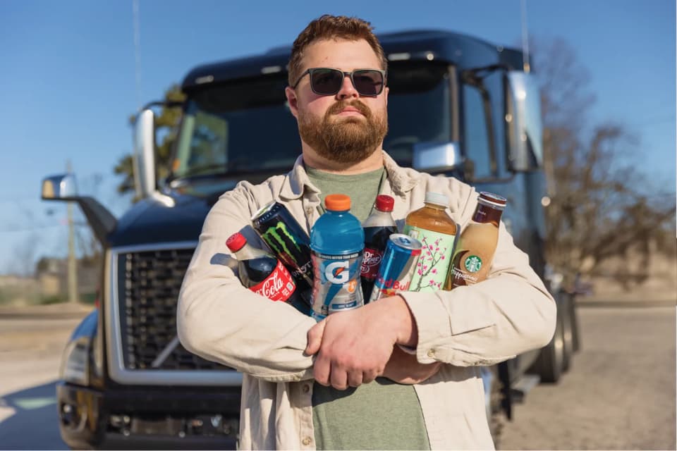 Pro driver with two arms full of drinks