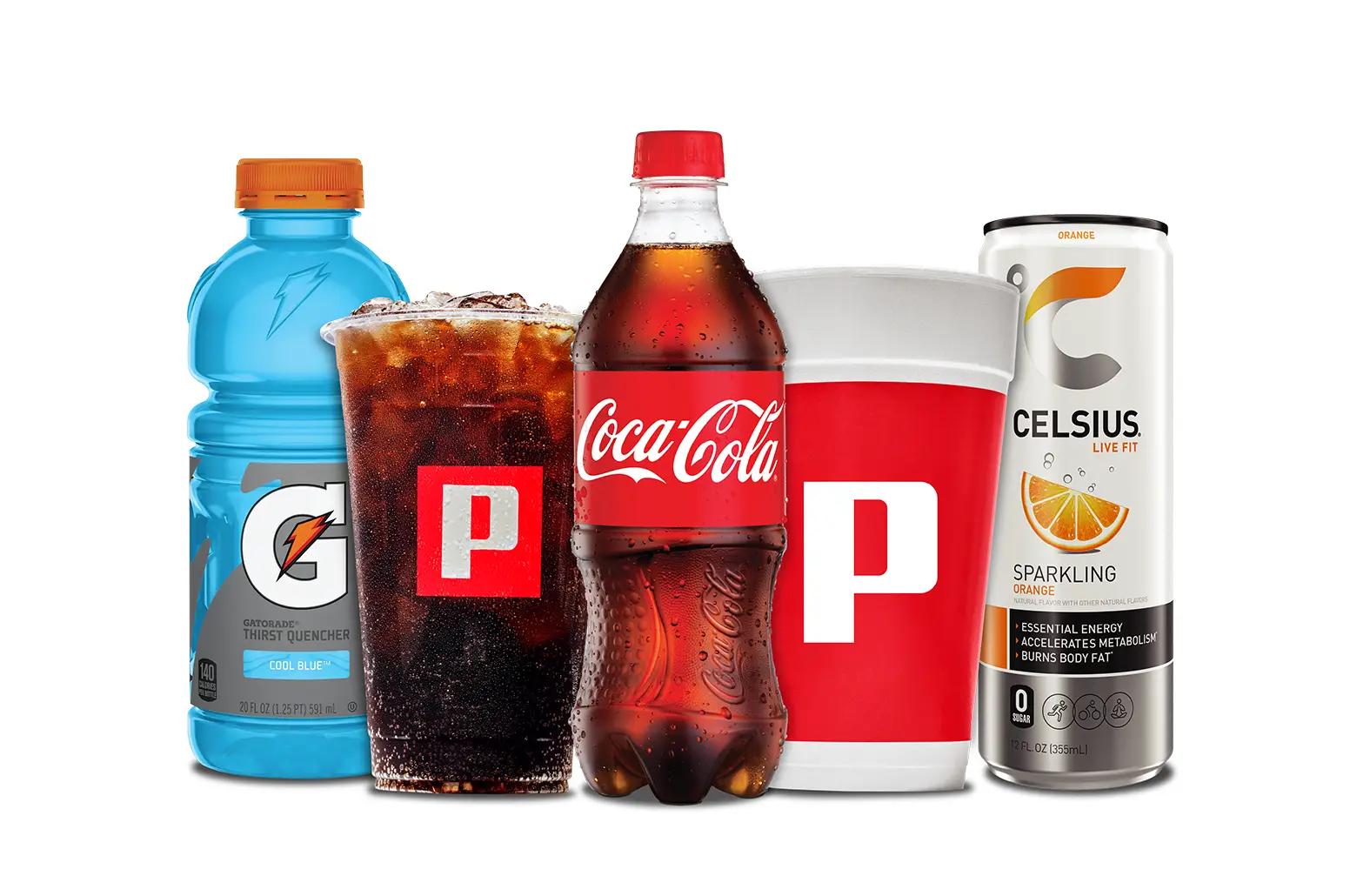 A lineup of a bottle of blue Gatorade, a Pilot fountain drink, a bottle of Coca-Cola, a cup of Pilot coffee, and a can of Celsius
