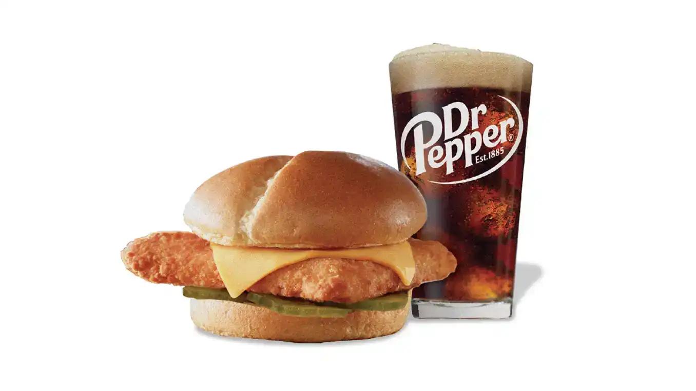 Sandwich with steak and cheese with a Dr. Pepper