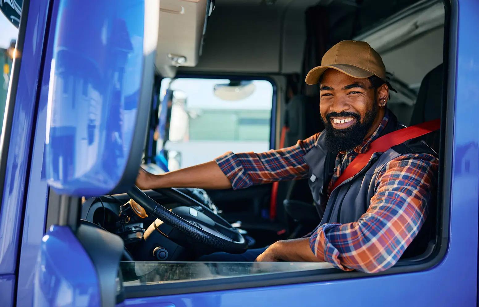 pro driver behind steering wheel in a cab