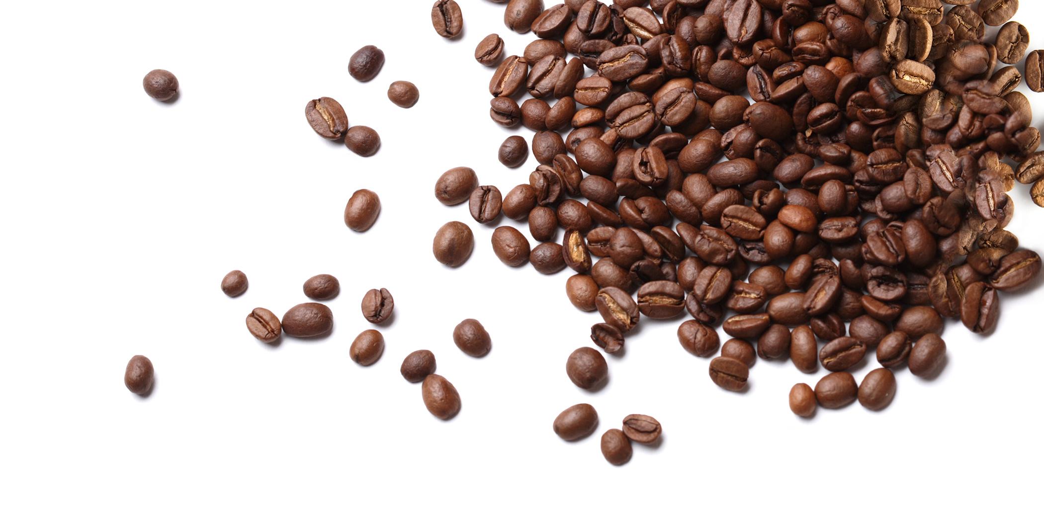 Coffee Beans scattered across a tabletop