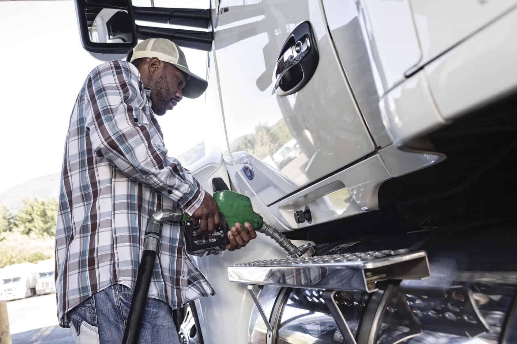 Pro driver filling up tank with fuel