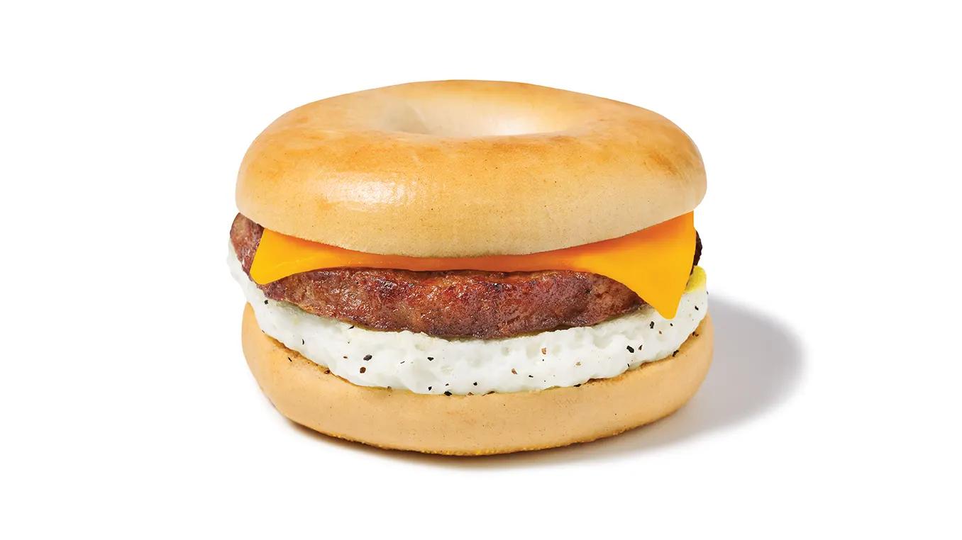 a sausage, egg, and cheese bagel with American cheese