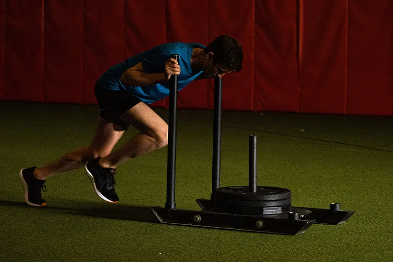 Man pushing weights