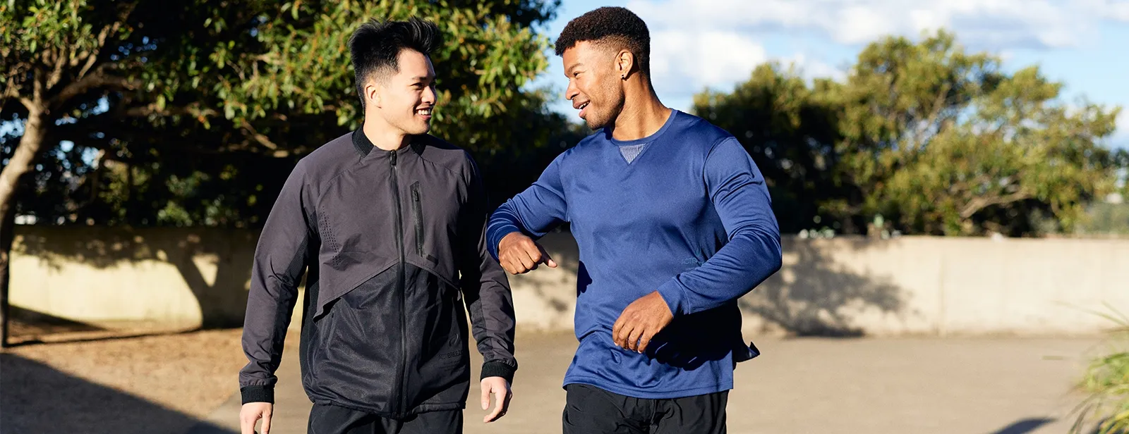 Two men one wearing an actibreeze jacket and other wearing a long sleeve top