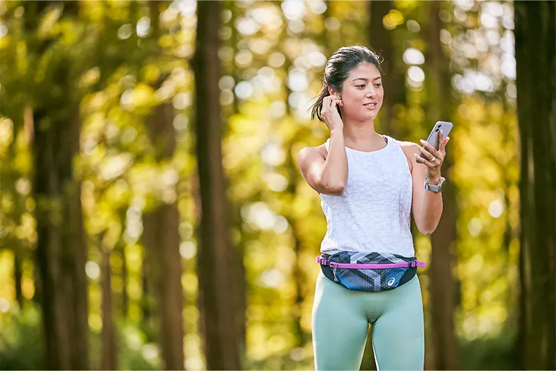 Women running outside in forest