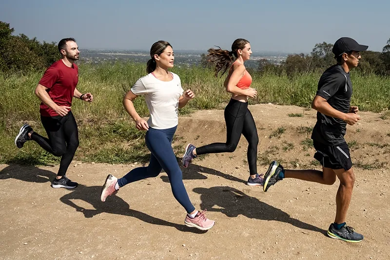 4 people running in Asics shoes