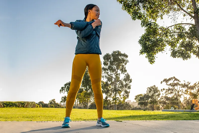 Woman stretching upper body outdoor