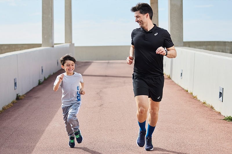 man and child running