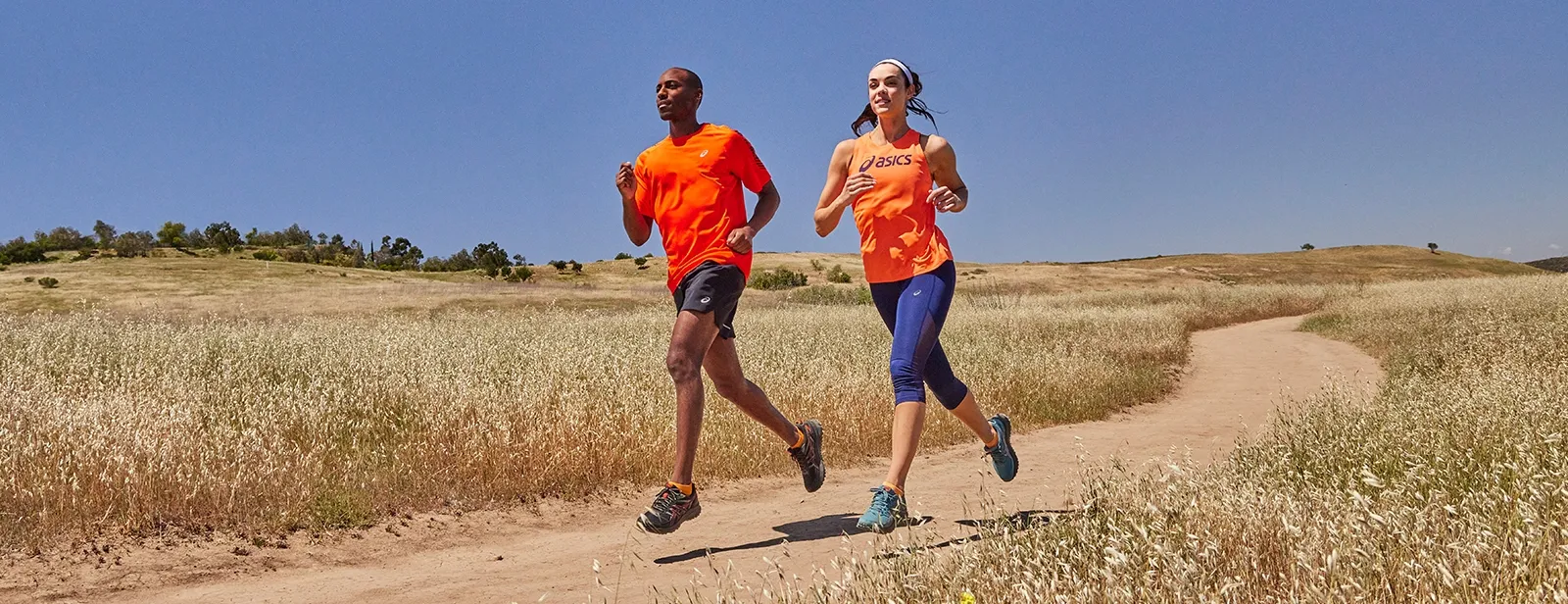 Two people running the trail