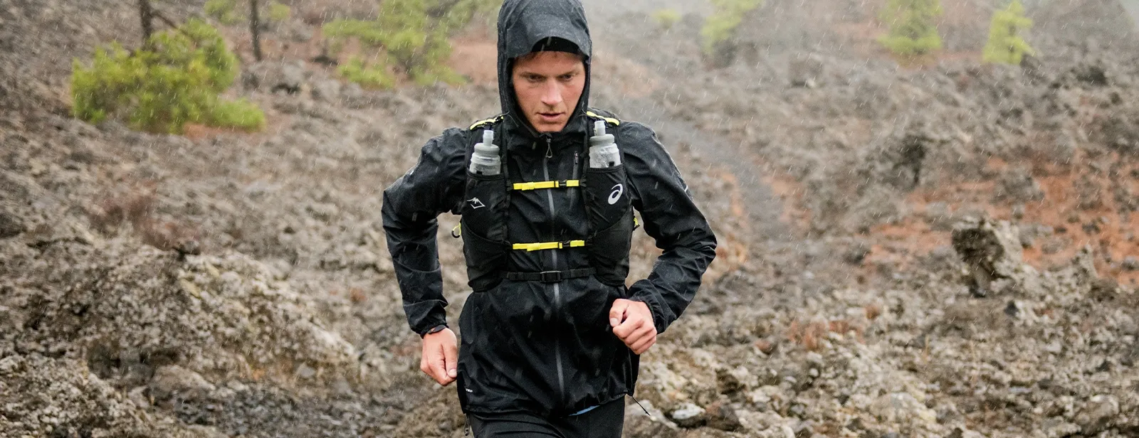 Man running outside in rain gear