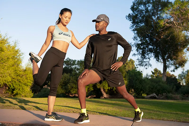 man and woman stretching post run