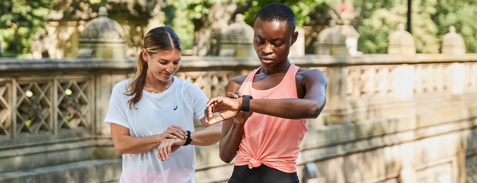 Two runners looking at the time on there watches