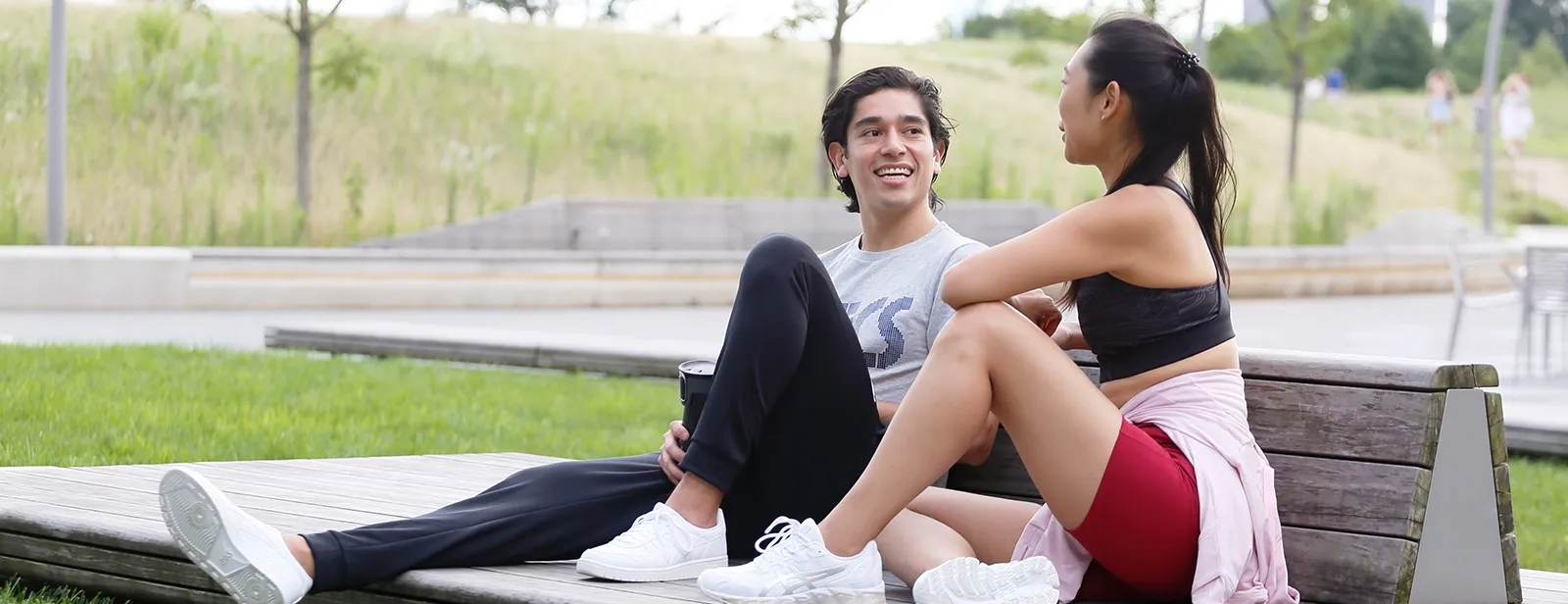 Man and Women sitting outside talking