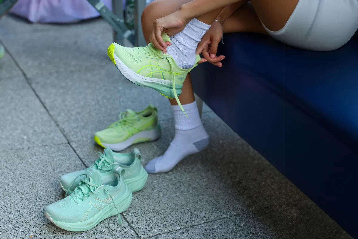 athlete putting shoes on