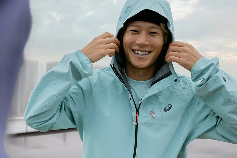 ASICS model wearing ASICS gear.