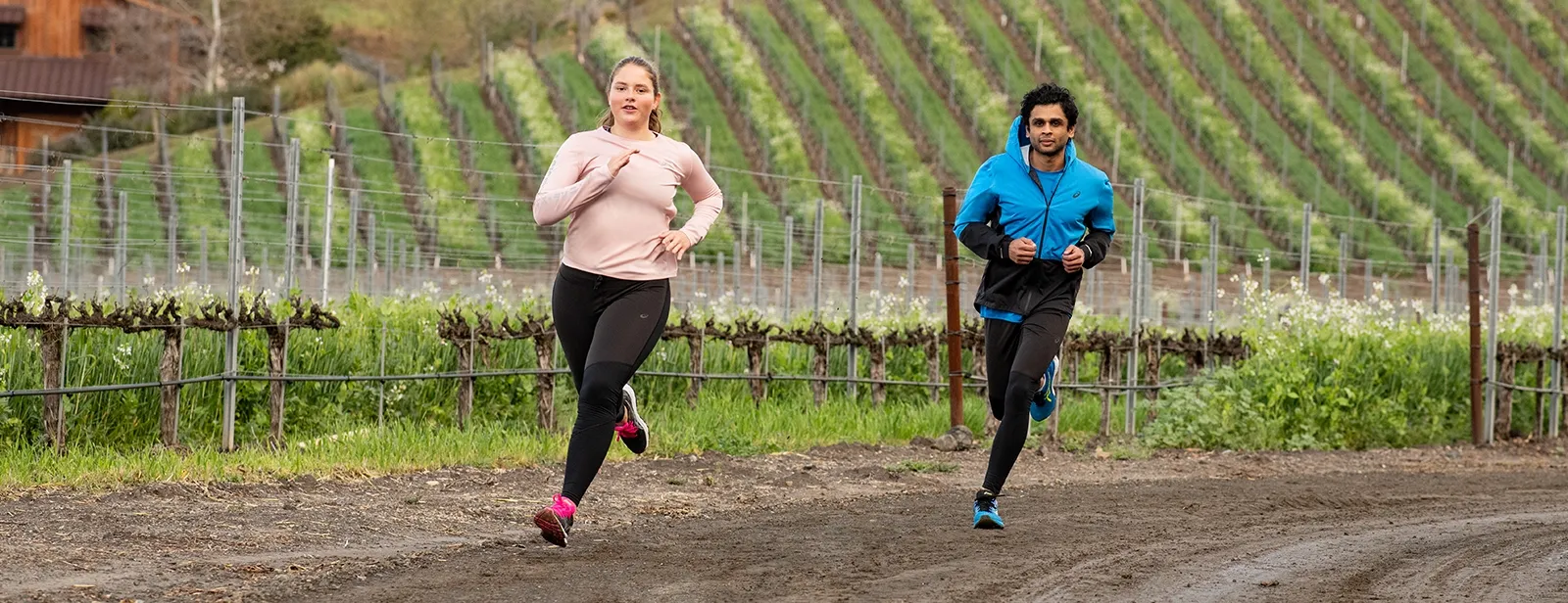 A woman and man running outdoors