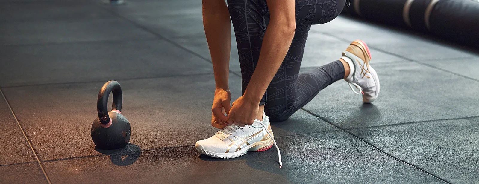 woman tying her shoes