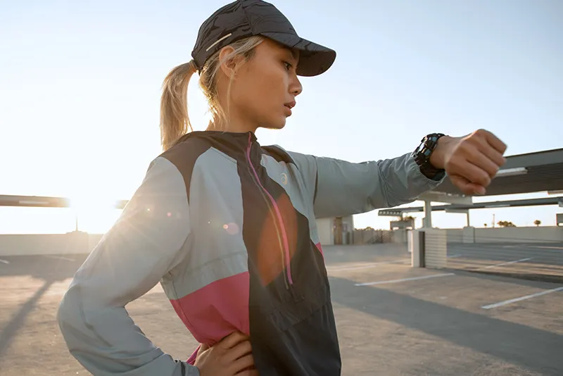 woman checking watch outside