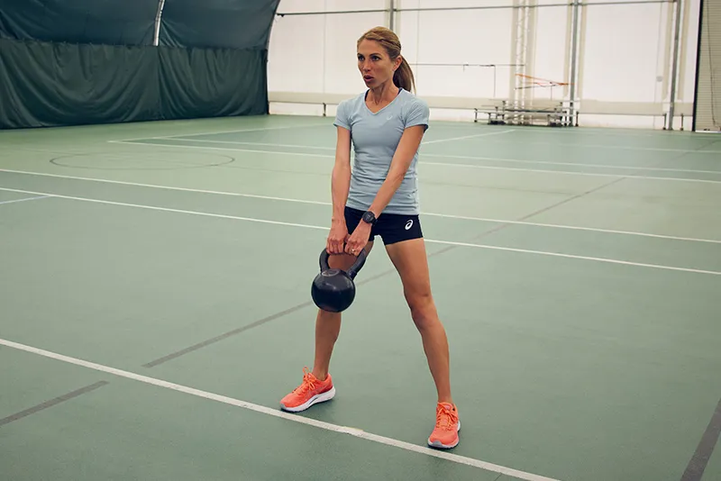 Women using a kettleball