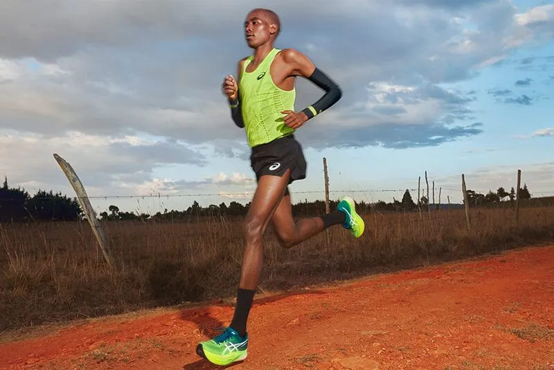 Man running in ASICS Metarun split short