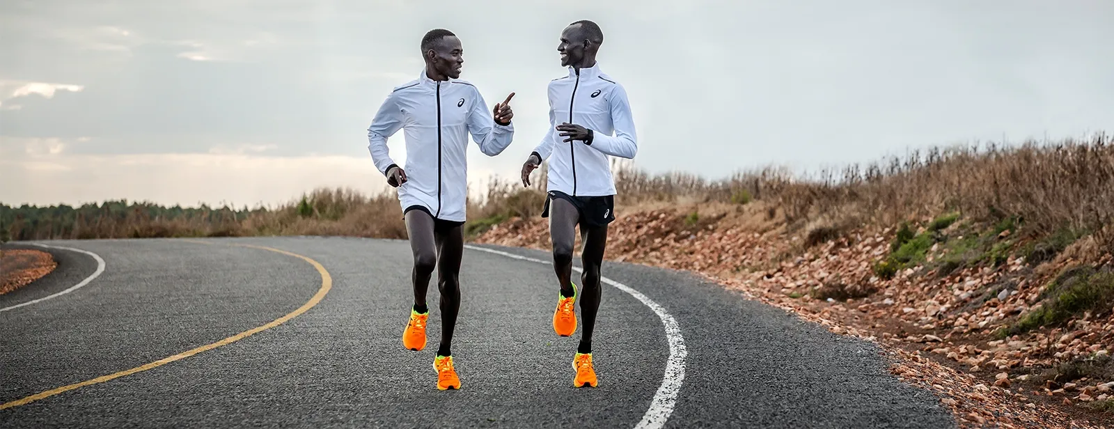Two people running outside