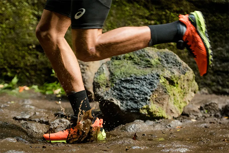 ASICS running shoes running on wet ground
