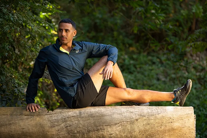 Man stretching lower body outdoor