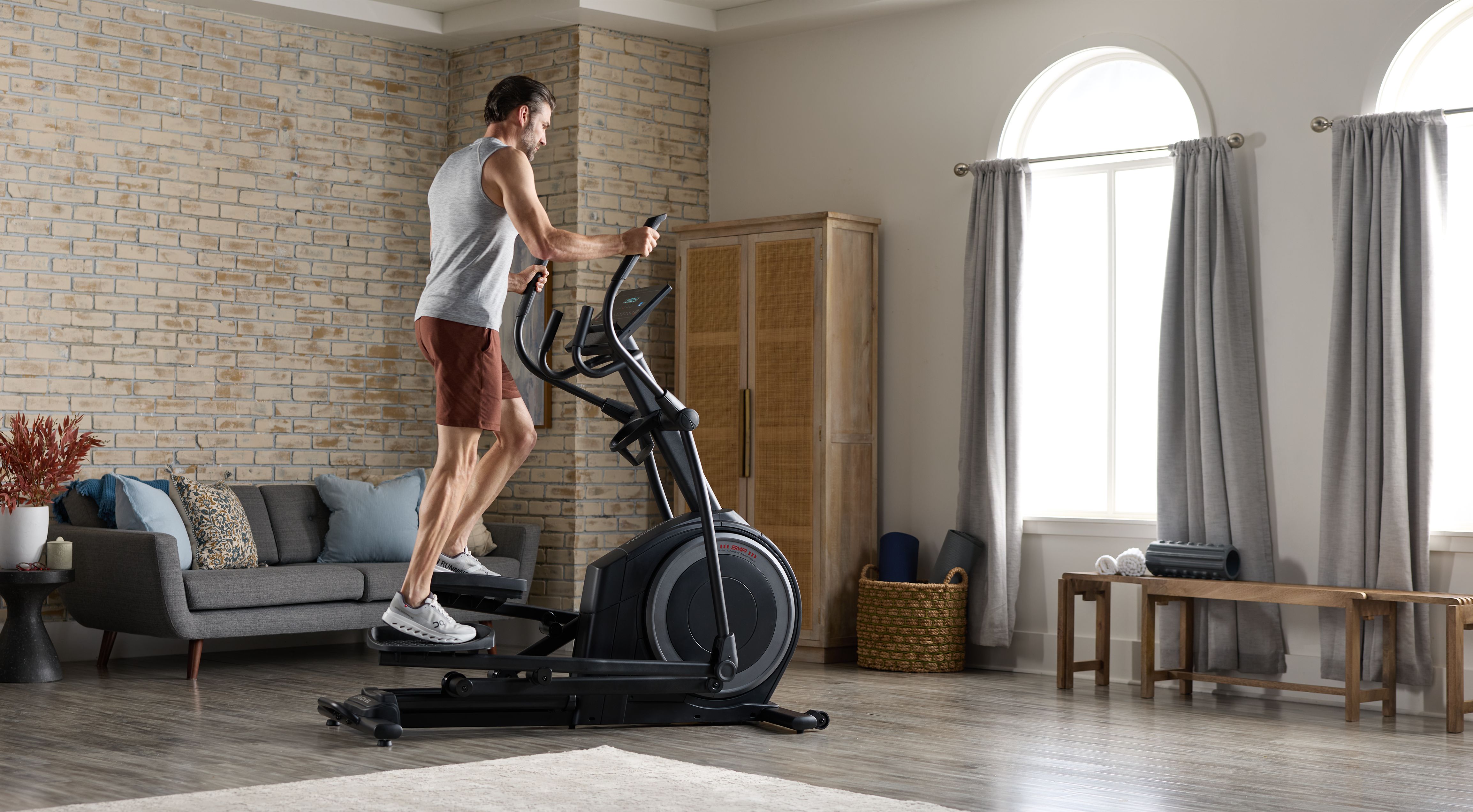 Elliptical machine in a bright home workout space