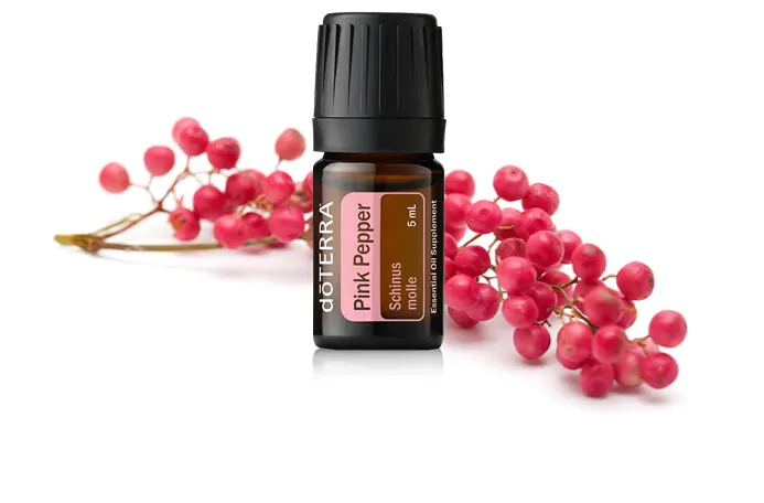 doTERRA Pink Pepper essential oil bottle with pink peppercorn berries