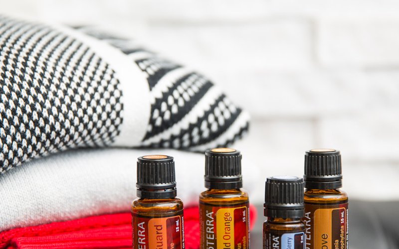 A lineup of doTERRA essential oil bottles.