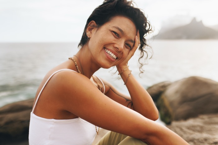 Wellness Advocate relaxing at the beach