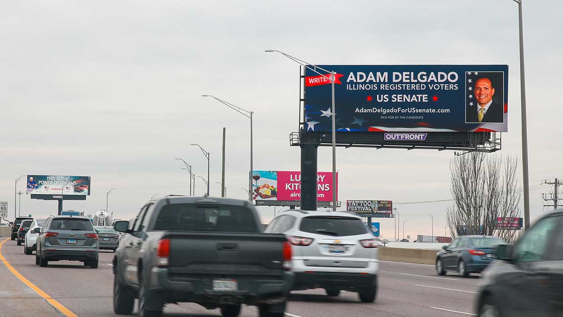 Political candidate advertising for Adam Delgado on a digital billboard
