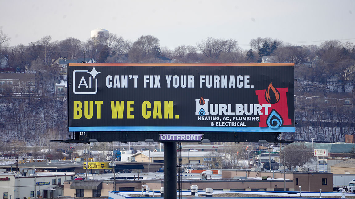 Hurlburt Heating billboard with “AI Can’t Fix Your Furnace” tagline