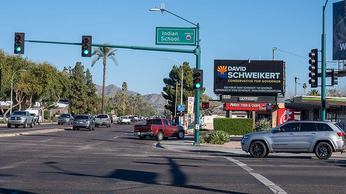 Political candidate advertising for David Schweikert on poster billboard