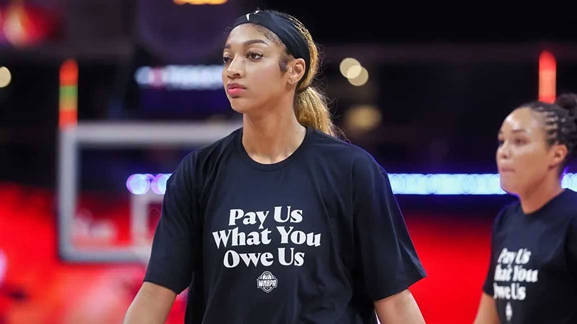 Angel Reese wearing “pay us what you owe us” t-shirt during WNBA All-Star Practice