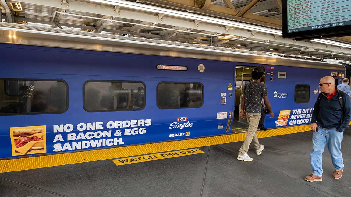 Wrapped married pair ad on LIRR train