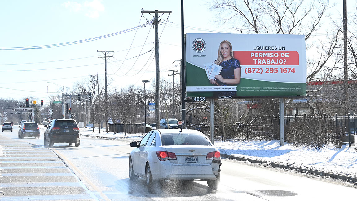 Poster billboard for immigration attorney in Chicago neighborhood, ad creative is in Spanish