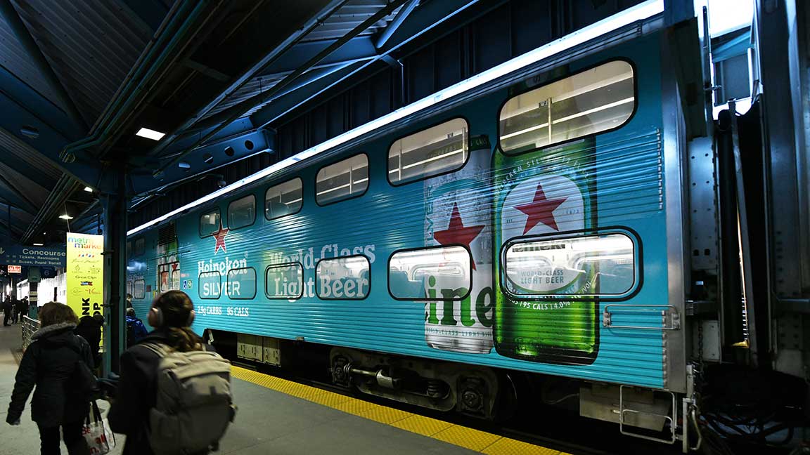 Metra commuter rail car in Chicago with Heineken train wrap