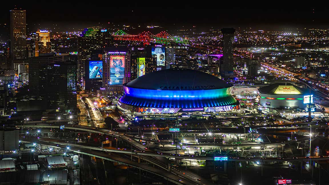 Bud Light building wrap next to Caesars Superdome in New Orleans for Super Bowl LIX