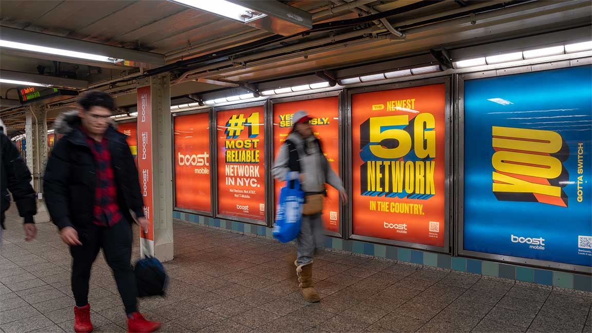 New York City traditional static subway advertising for Boost Mobile