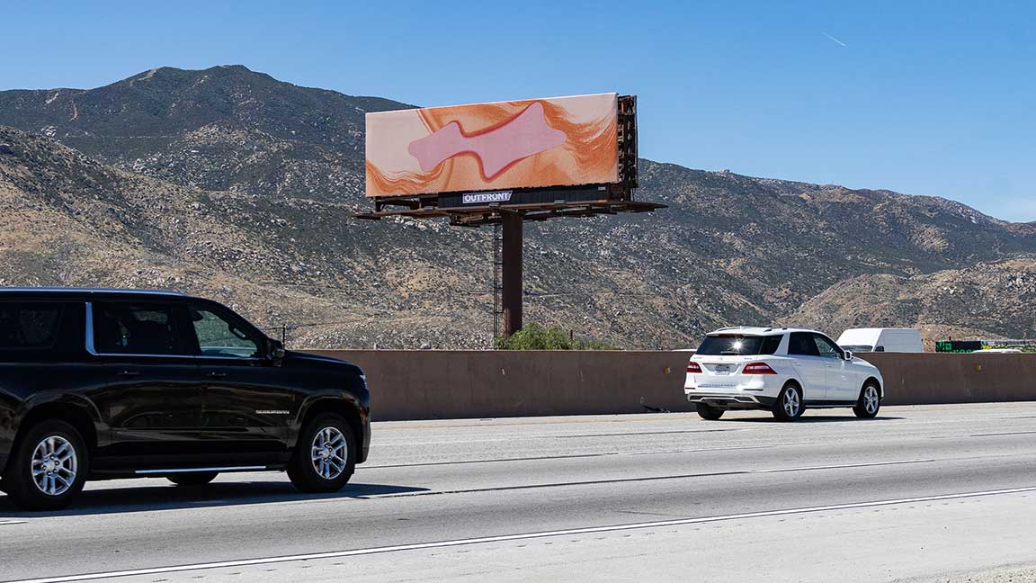 Cryptic Justin Bieber (Def Jam Records) billboard outside Coachella 2026