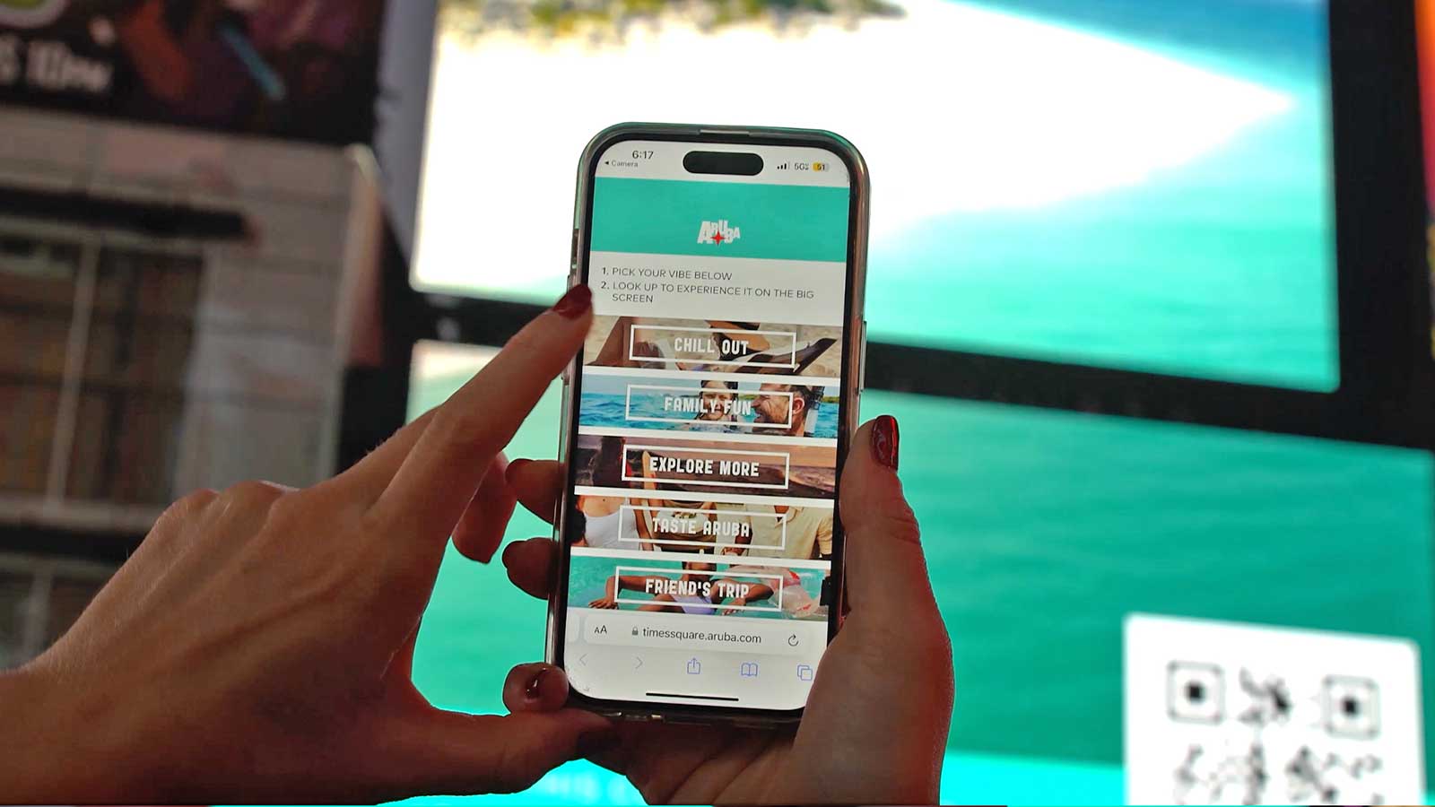 Times Square visitor interacting with Aruba Tourism campaign via QRad content control