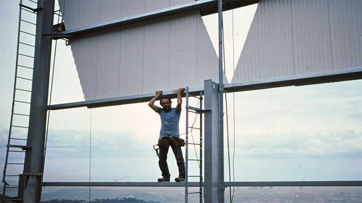 Pacific Outdoor (now OUTFRONT) technician restoring Hollywood sign in 1978