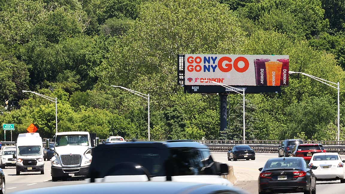 Dunkin IRL ad on digital billboard in New Jersey