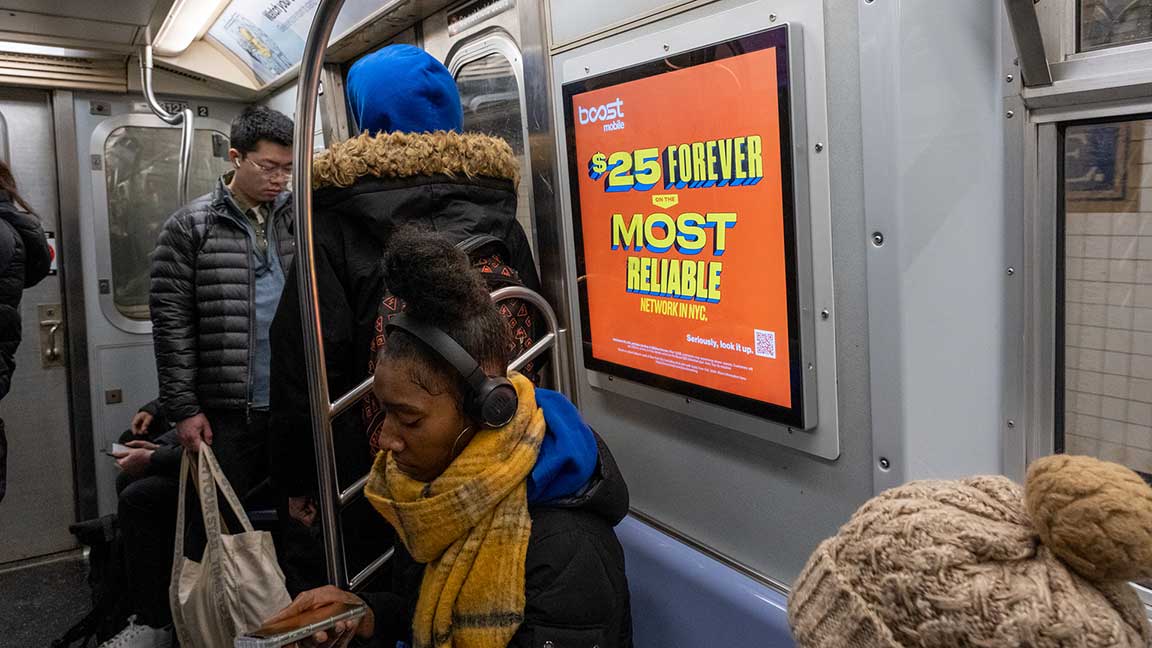 Boost Mobile offer on NYC subway Livecard digital out of home