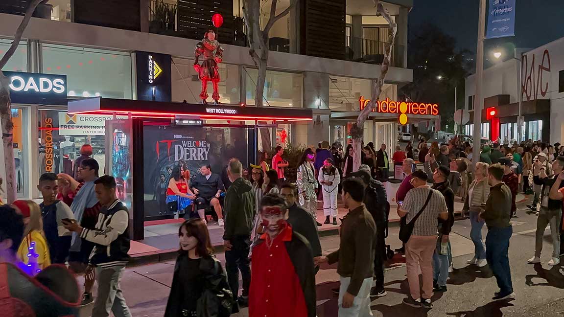 Restored Pennywise sculpture on HBO IT: Welcome to Derry bus shelter buildout during West Hollywood Halloween celebration